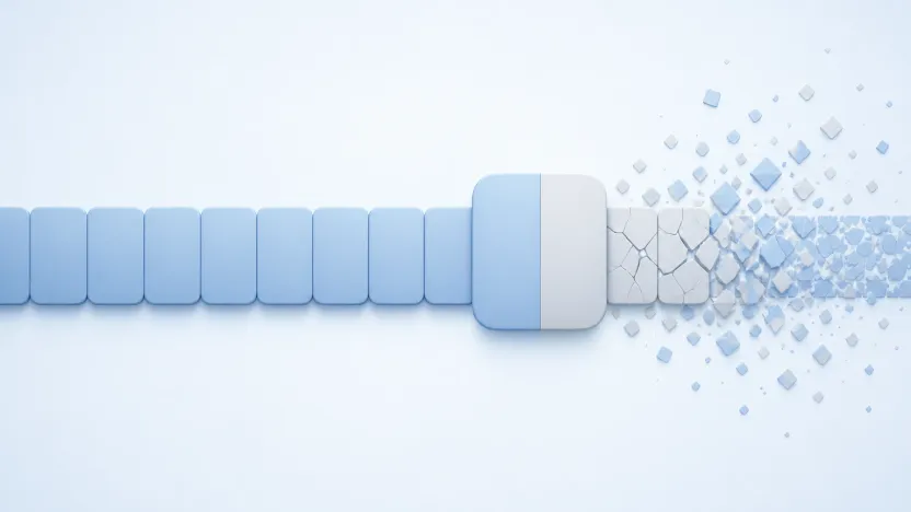 A band of pale blue blocks running left to right, one oversized block cut cleanly in half, and everything past the cut crumbling into fragments.