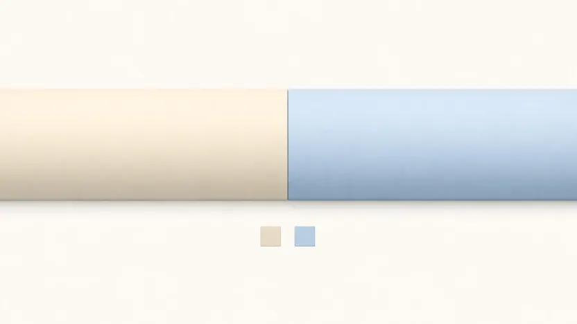 Two thick pipes meeting seamlessly in the centre, one warm cream and one cool blue, with two identically shaped blocks in those two colours fallen out below.