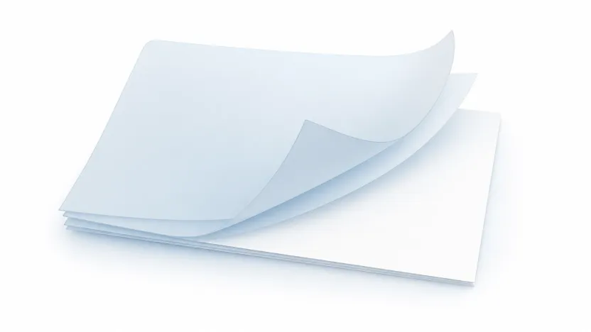 A stack of translucent sheets being pulled away to reveal a clean white page, with two or three sheets jammed at the top.